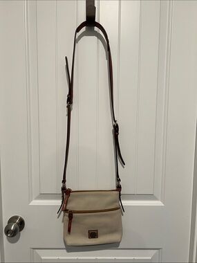 Dooney & Bourke Women’s Cream Pebbled Leather Crossbody with Brown Trim